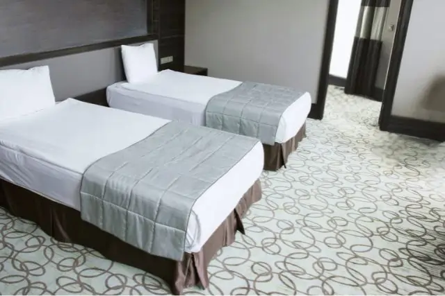 Modern hotel room with elegant loop-patterned carpet flooring in Dubai