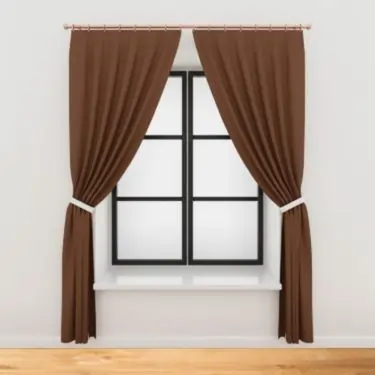 Brown curtain installation by Interior Decoration Company in Dubai in a white room with wooden floor